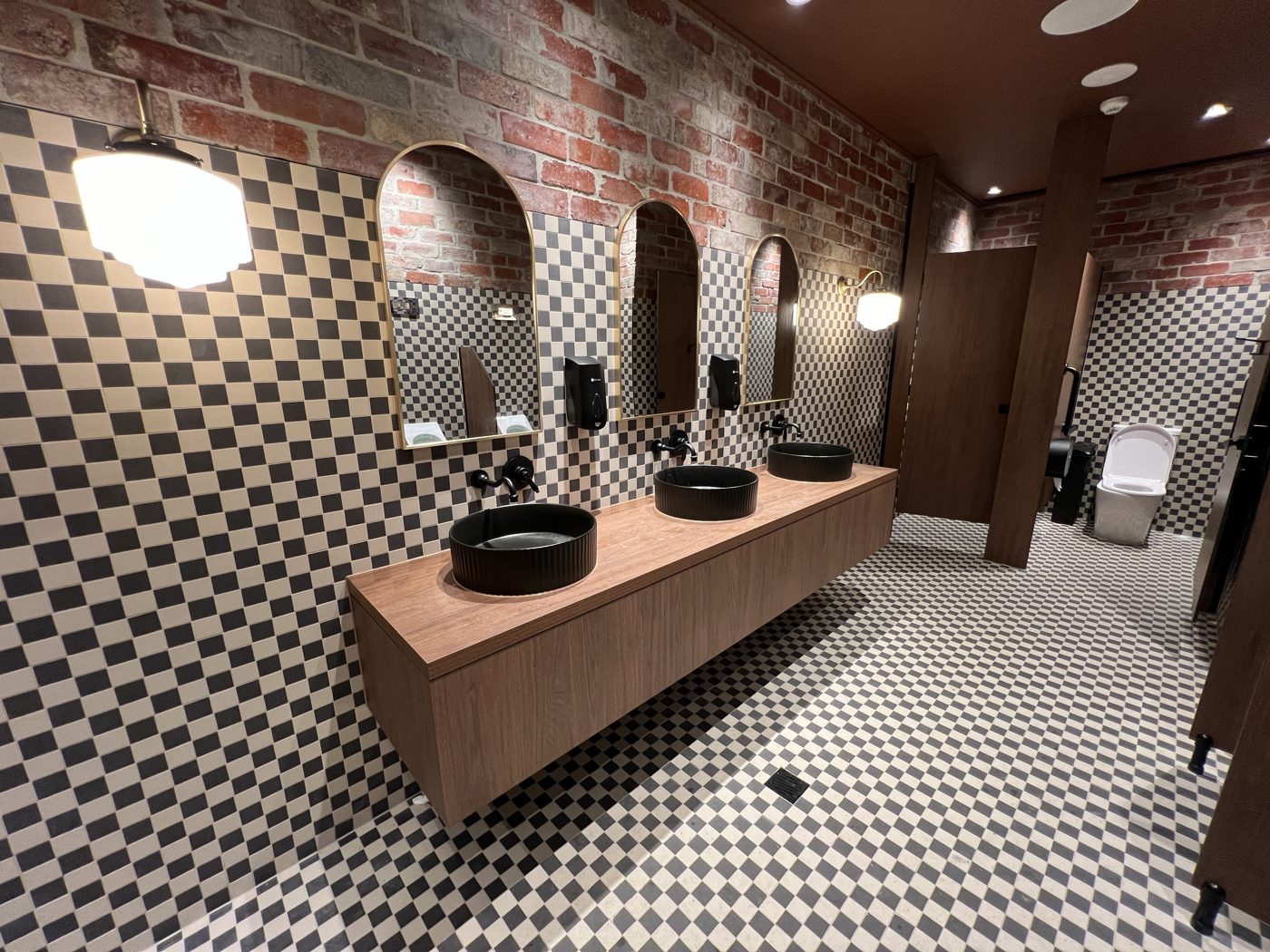 Commercial washroom with feature checkerboard walls