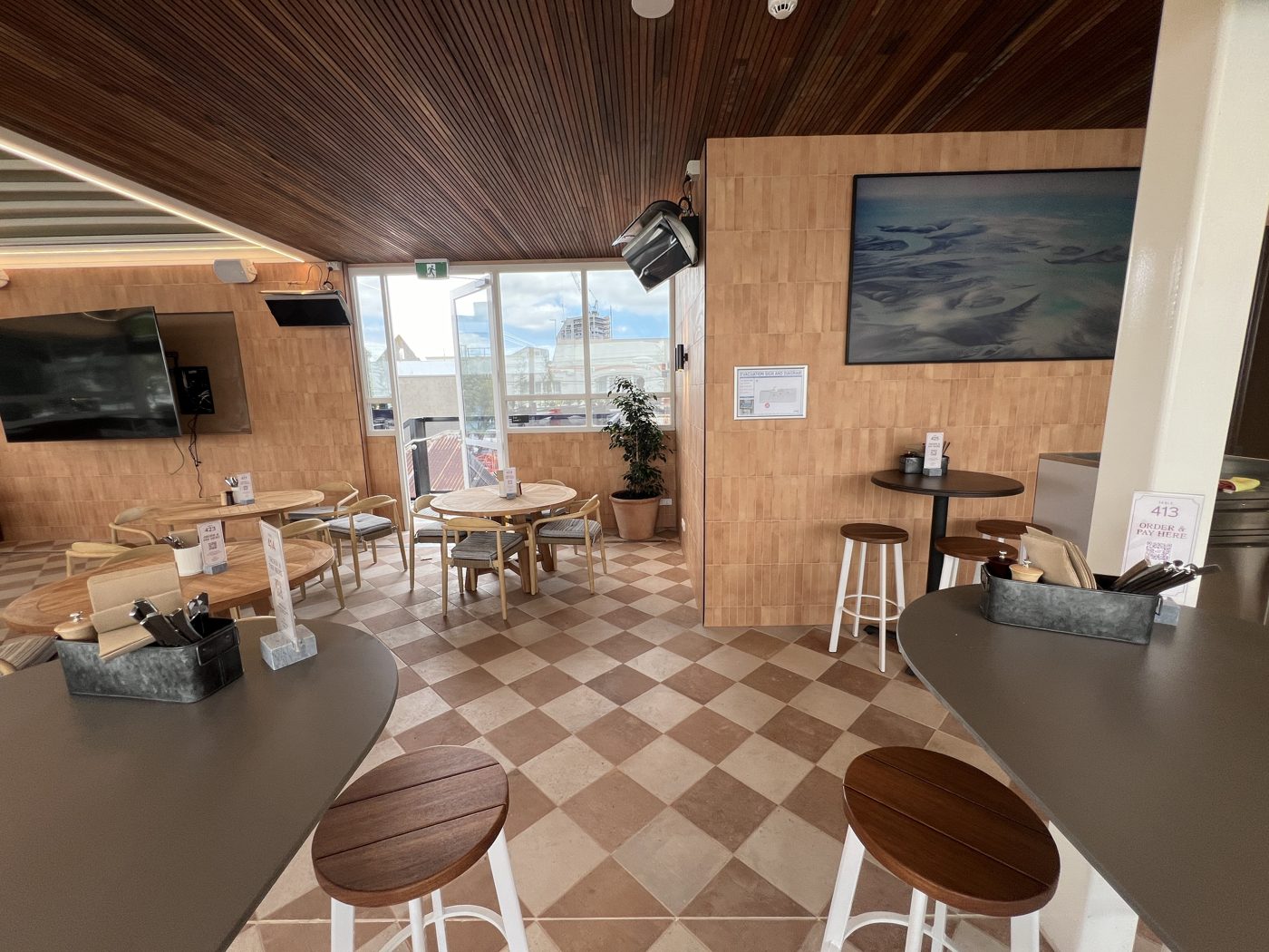 Rooftop dining area with checkerboard floor