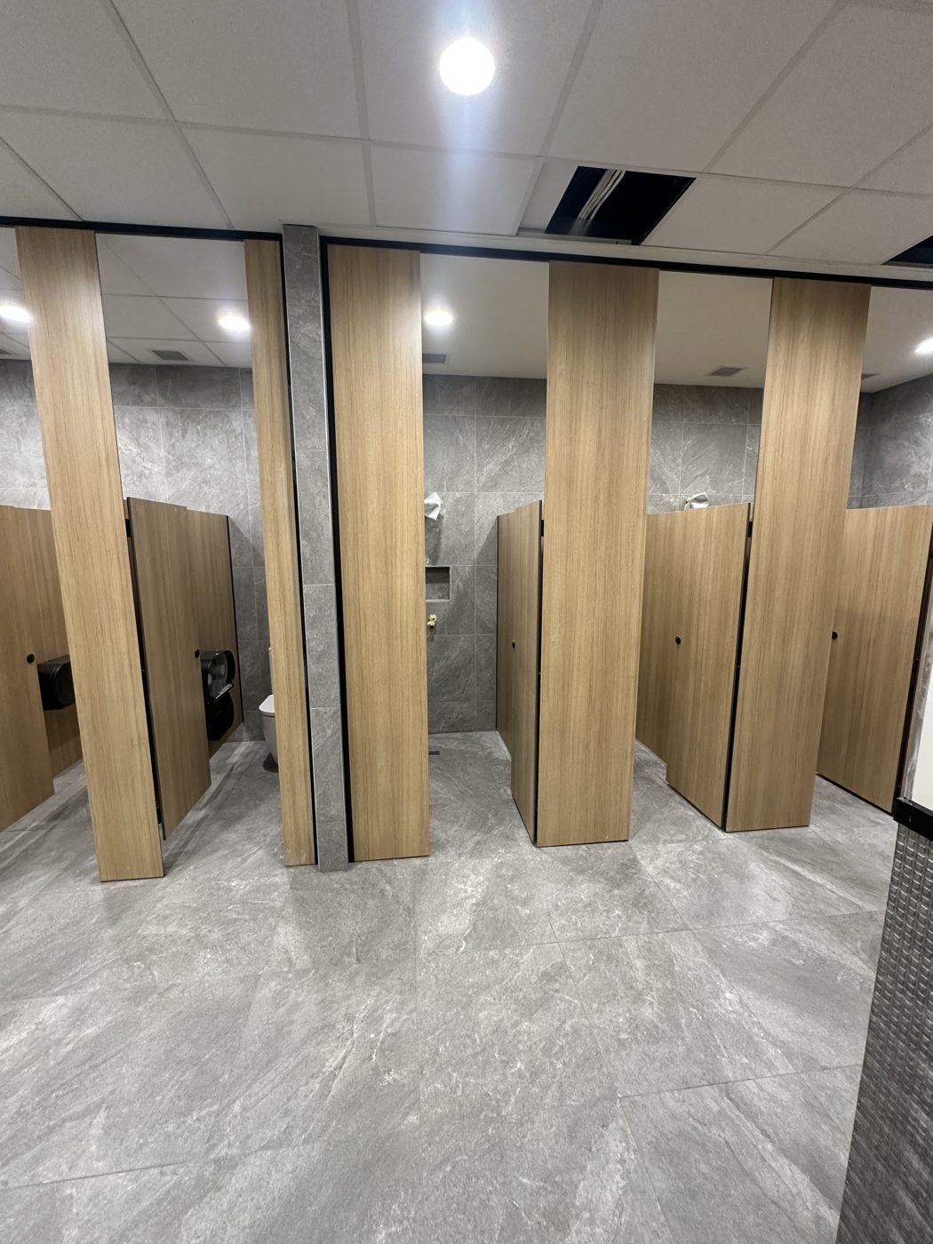 Washroom fit-out with large-format tiling and timber